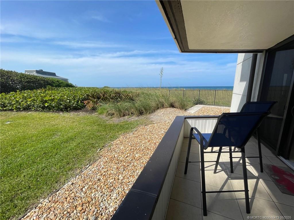 1357 Northeast Ocean Boulevard, Unit 106 Stuart, FL 34996 - Photo 22 of 38 a view of a chairs and table in patio