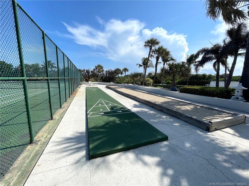 1357 Northeast Ocean Boulevard, Unit 106 Stuart, FL 34996 - Photo 28 of 38 a view of a street with a building in the background