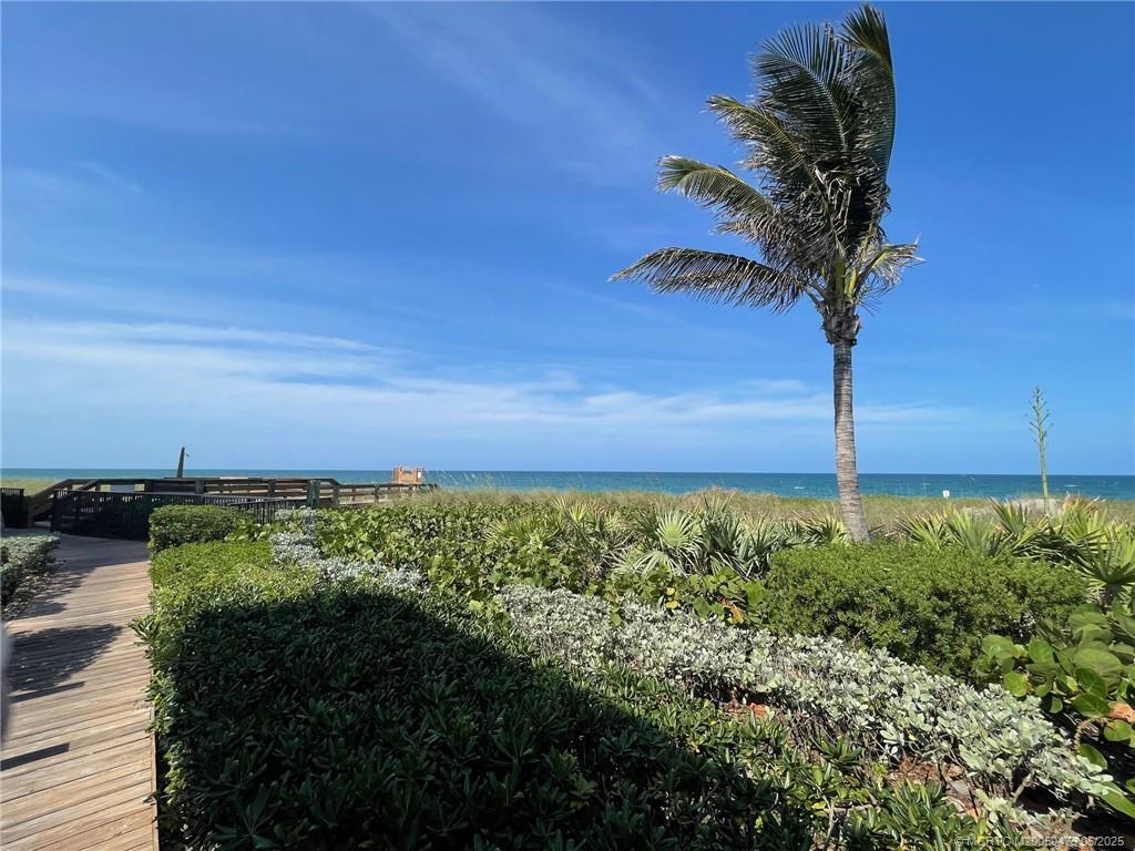 1357 Northeast Ocean Boulevard, Unit 106 Stuart, FL 34996 - Photo 33 of 38 a view of a yard with an ocean