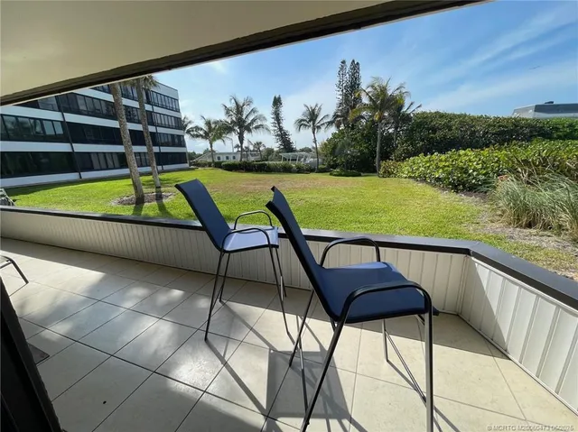 a view of a swimming pool with a lounge chairs