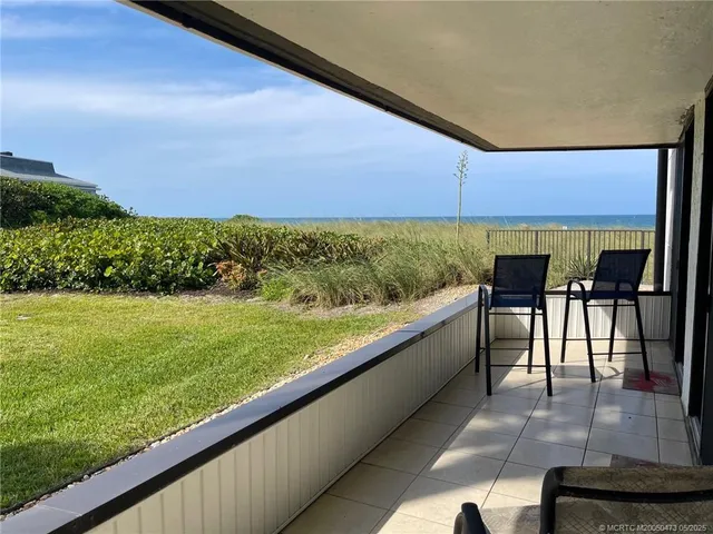 a view of swimming pool from a balcony