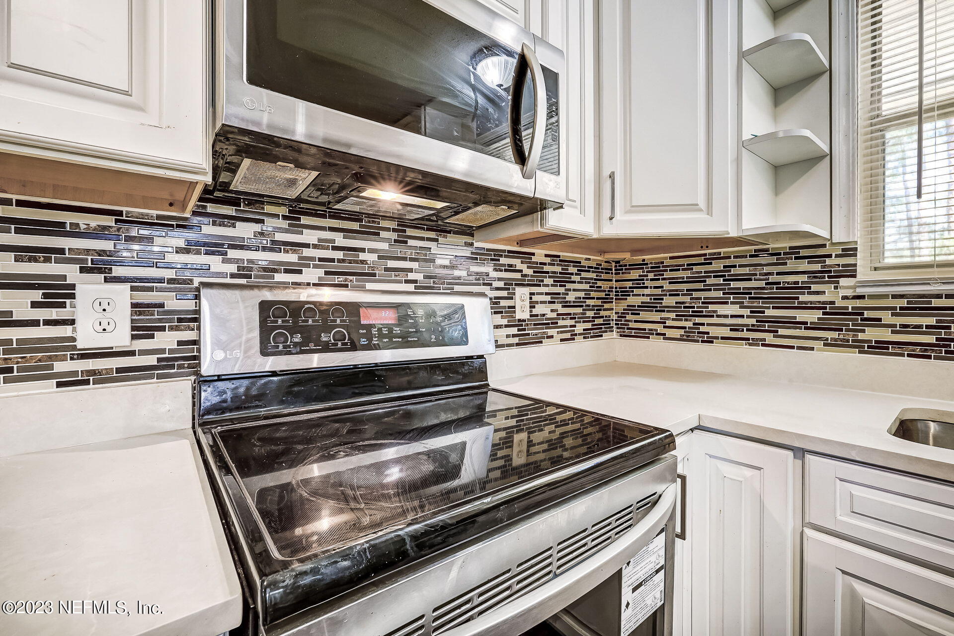 3546 Clyde Drive Jacksonville, FL 32208 - Photo 21 of 50 a stove top oven sitting inside of a kitchen