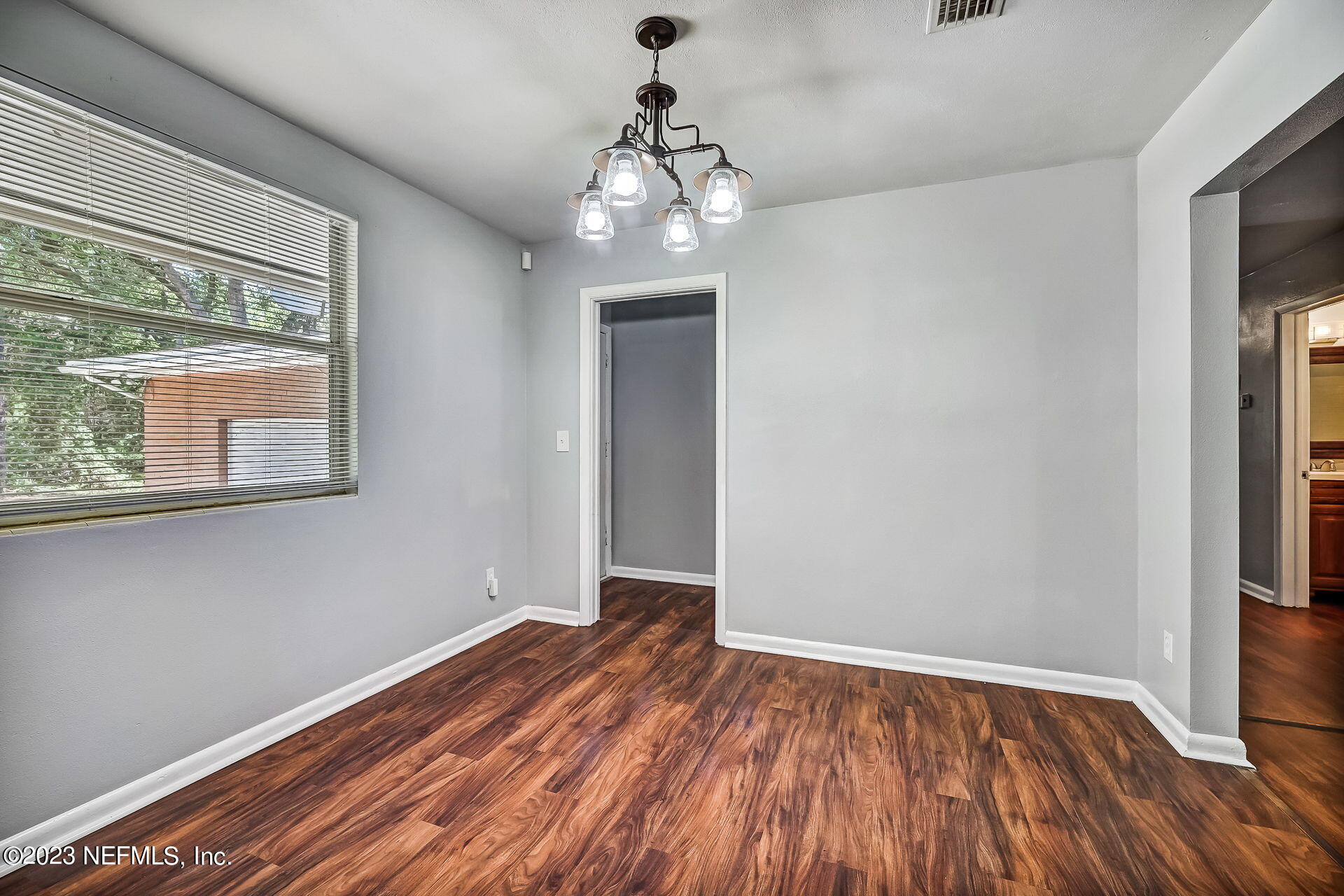 3546 Clyde Drive Jacksonville, FL 32208 - Photo 23 of 50 a view of empty room with wooden floor and fan
