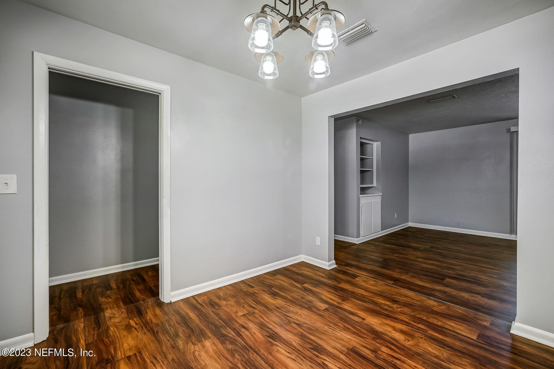 3546 Clyde Drive Jacksonville, FL 32208 - Photo 24 of 50 a view of an empty room with wooden floor and a window
