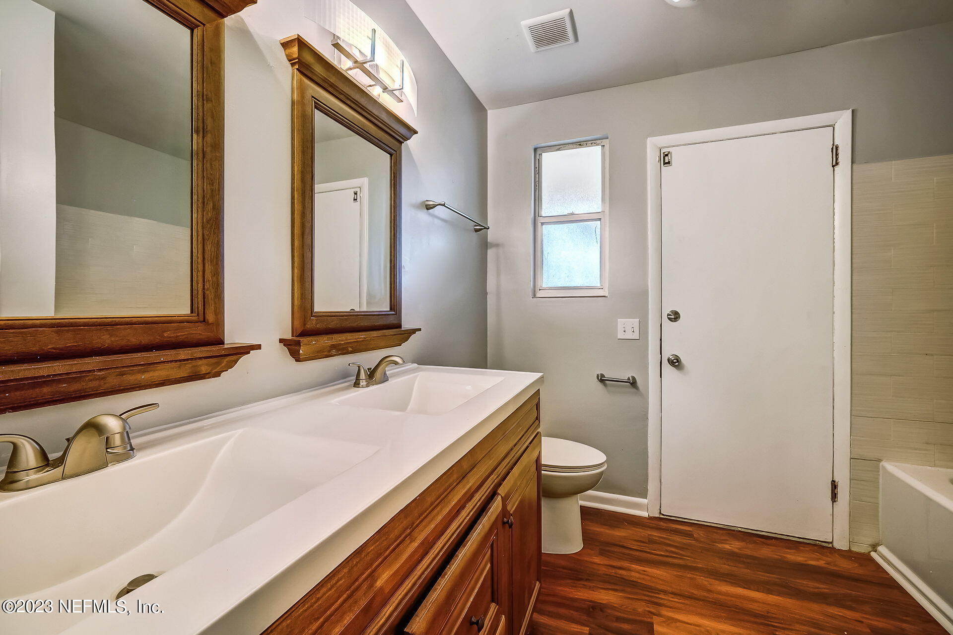 3546 Clyde Drive Jacksonville, FL 32208 - Photo 27 of 50 a bathroom with a sink and a mirror