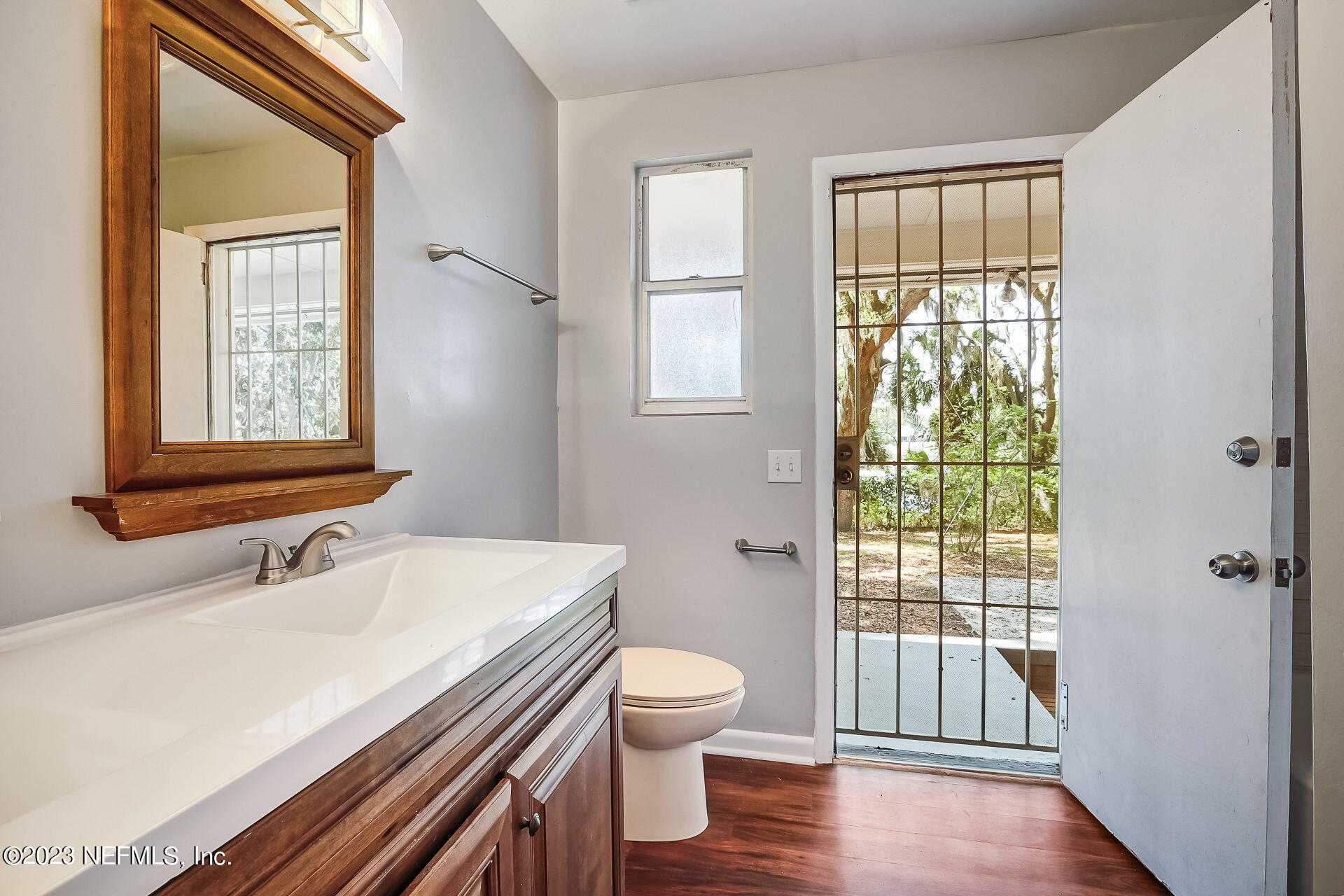 3546 Clyde Drive Jacksonville, FL 32208 - Photo 29 of 50 a bathroom with a sink a toilet and a window