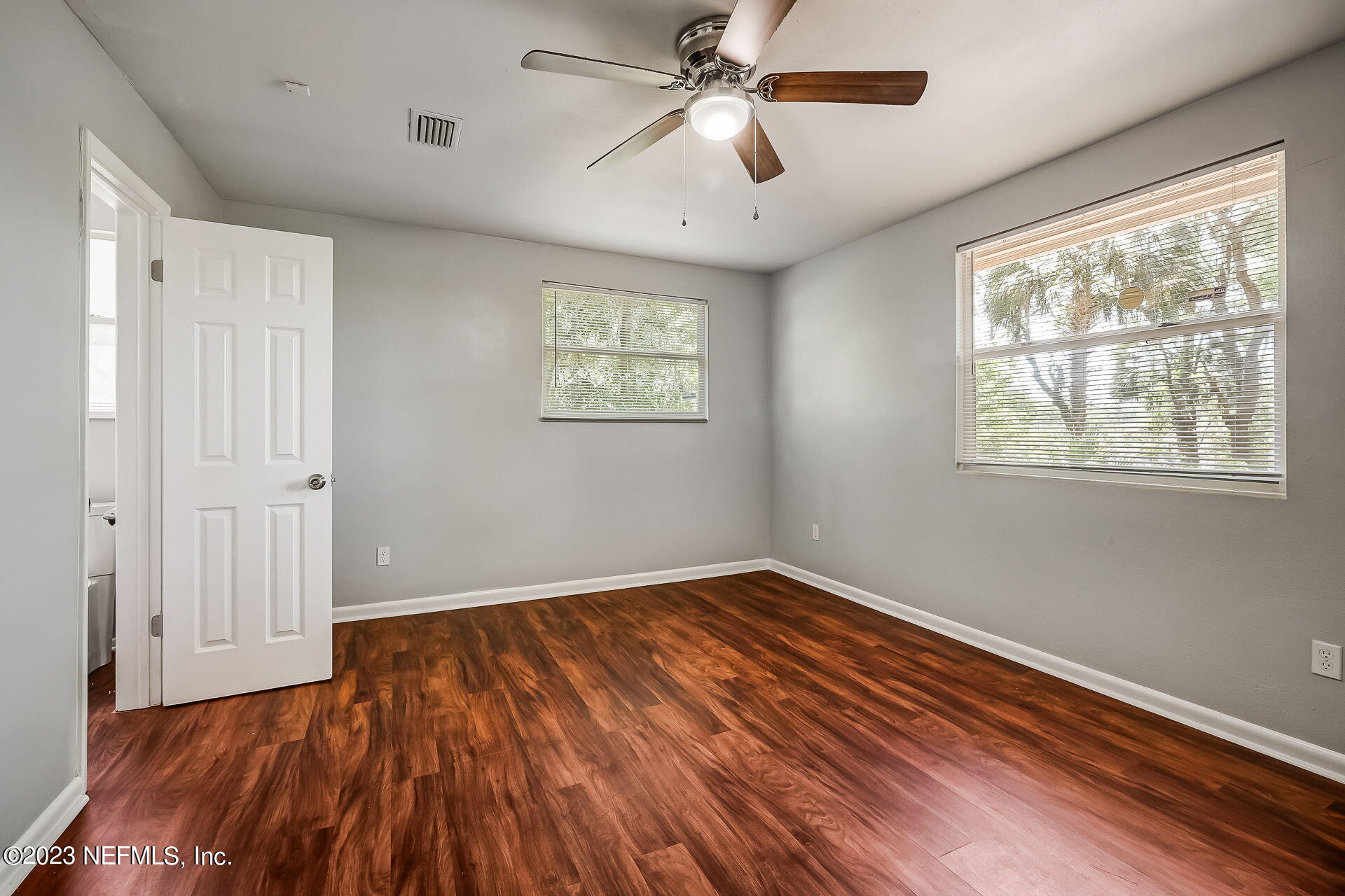 3546 Clyde Drive Jacksonville, FL 32208 - Photo 30 of 50 a view of empty room with wooden floor and fan
