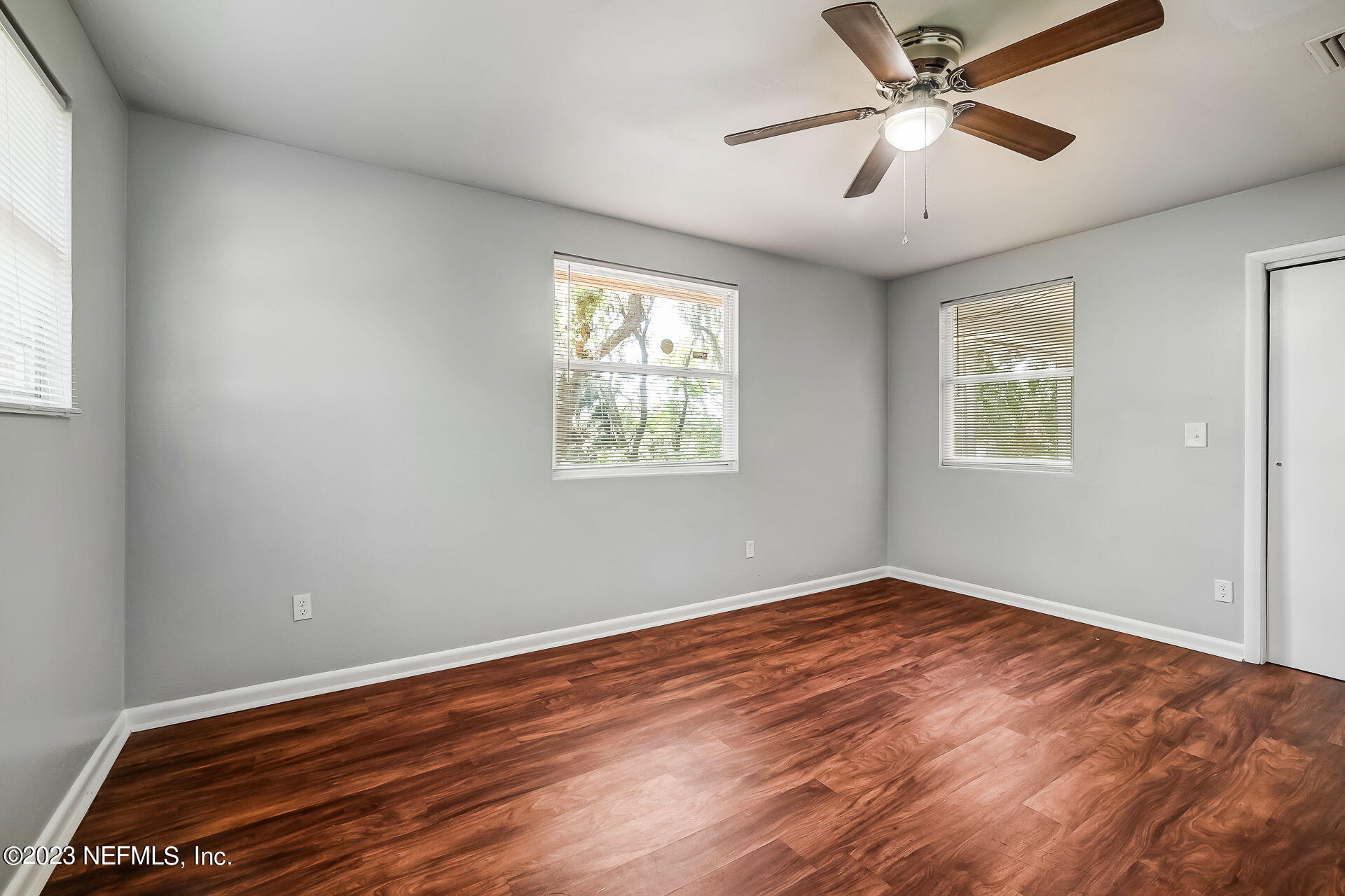 3546 Clyde Drive Jacksonville, FL 32208 - Photo 32 of 50 a view of empty room with wooden floor and fan