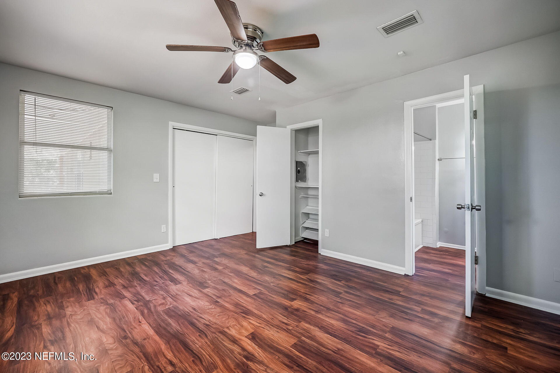 3546 Clyde Drive Jacksonville, FL 32208 - Photo 33 of 50 a view of an empty room with wooden floor