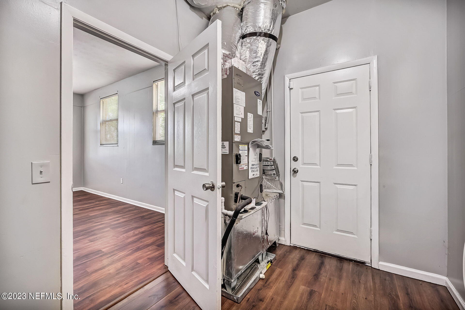 3546 Clyde Drive Jacksonville, FL 32208 - Photo 40 of 50 a view of a hallway with wooden floor and stairs