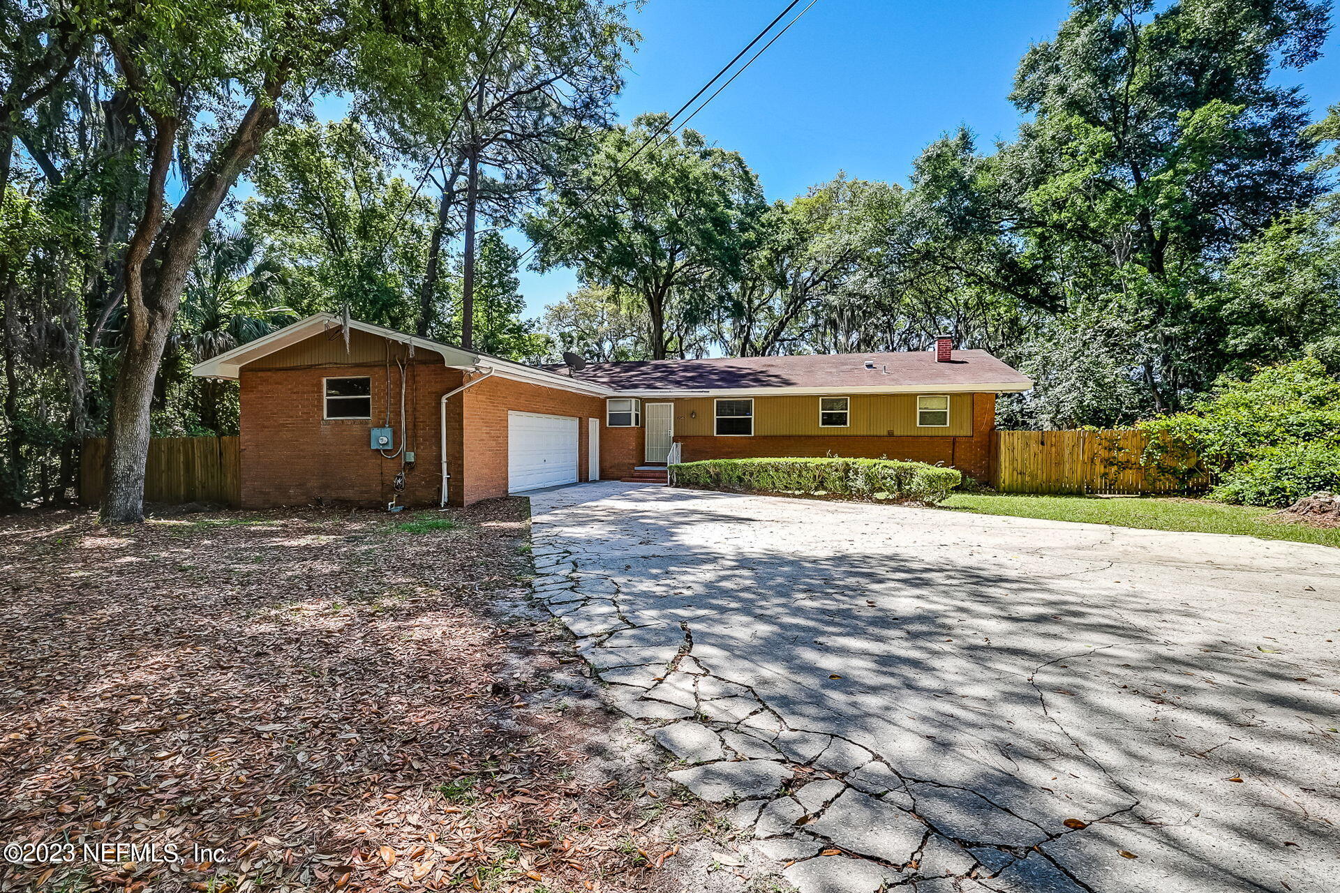 3546 Clyde Drive Jacksonville, FL 32208 - Photo 7 of 50 a front view of a house with a yard and garage