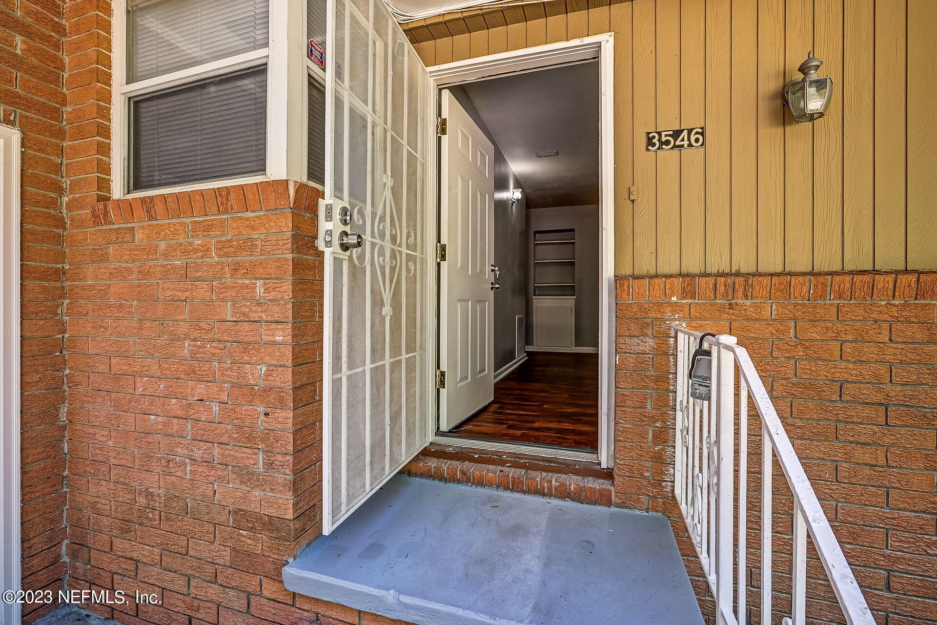 3546 Clyde Drive Jacksonville, FL 32208 - Photo 10 of 50 a view of a hallway with wooden floor and staircase