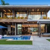 a view of a cafe with a table and chairs under an umbrella