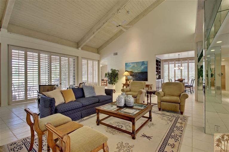 701 Inverness Drive Rancho Mirage, CA 92270 - Photo 4 of 25 a living room with furniture and a large window
