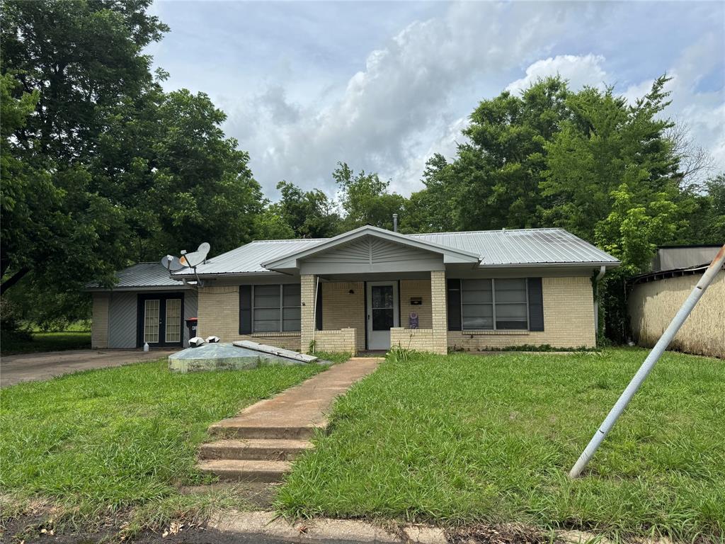 4515 Southeast Loop 286 Paris, TX 75460 - Photo 21 of 37 a view of a house with a yard