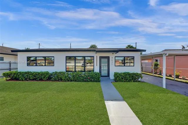 front view of a house with a yard