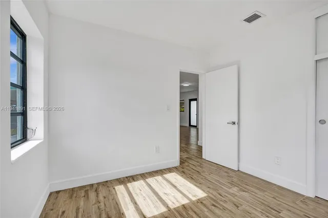 a view of an empty room and window