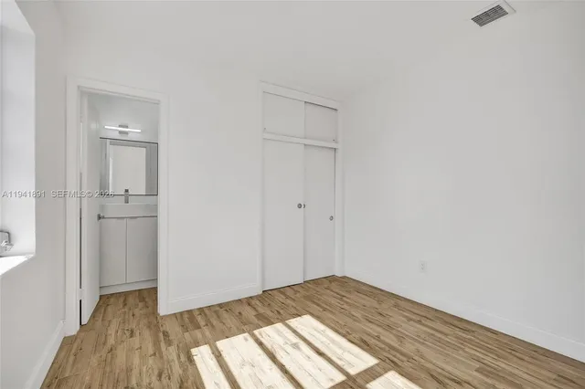 a view of a bedroom from the hallway