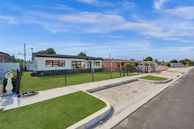 a view of swimming pool with a yard