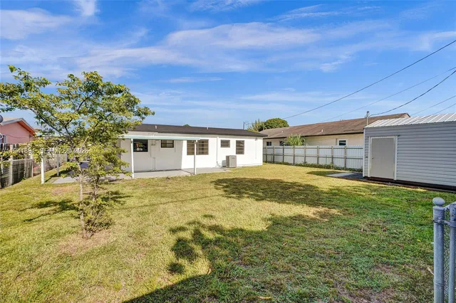 a view of a house with a big yard