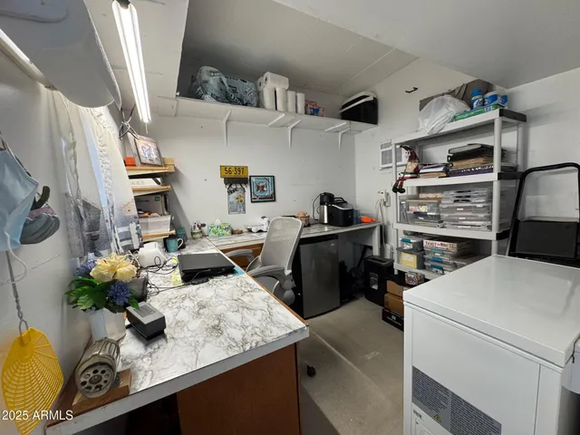 a kitchen with stainless steel appliances kitchen island granite countertop a sink dishwasher stove and cabinets