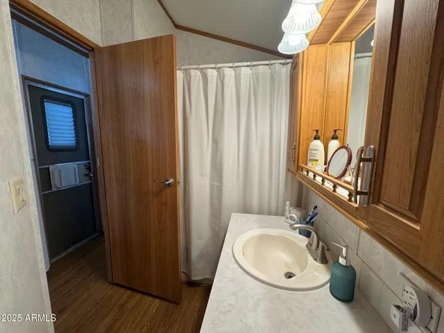 a bathroom with a sink toilet and tub