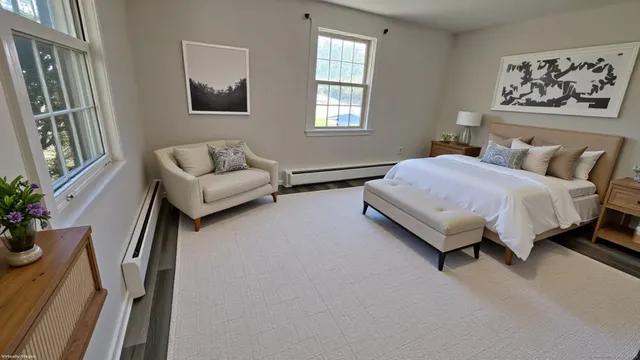 a spacious bedroom with a bed and window