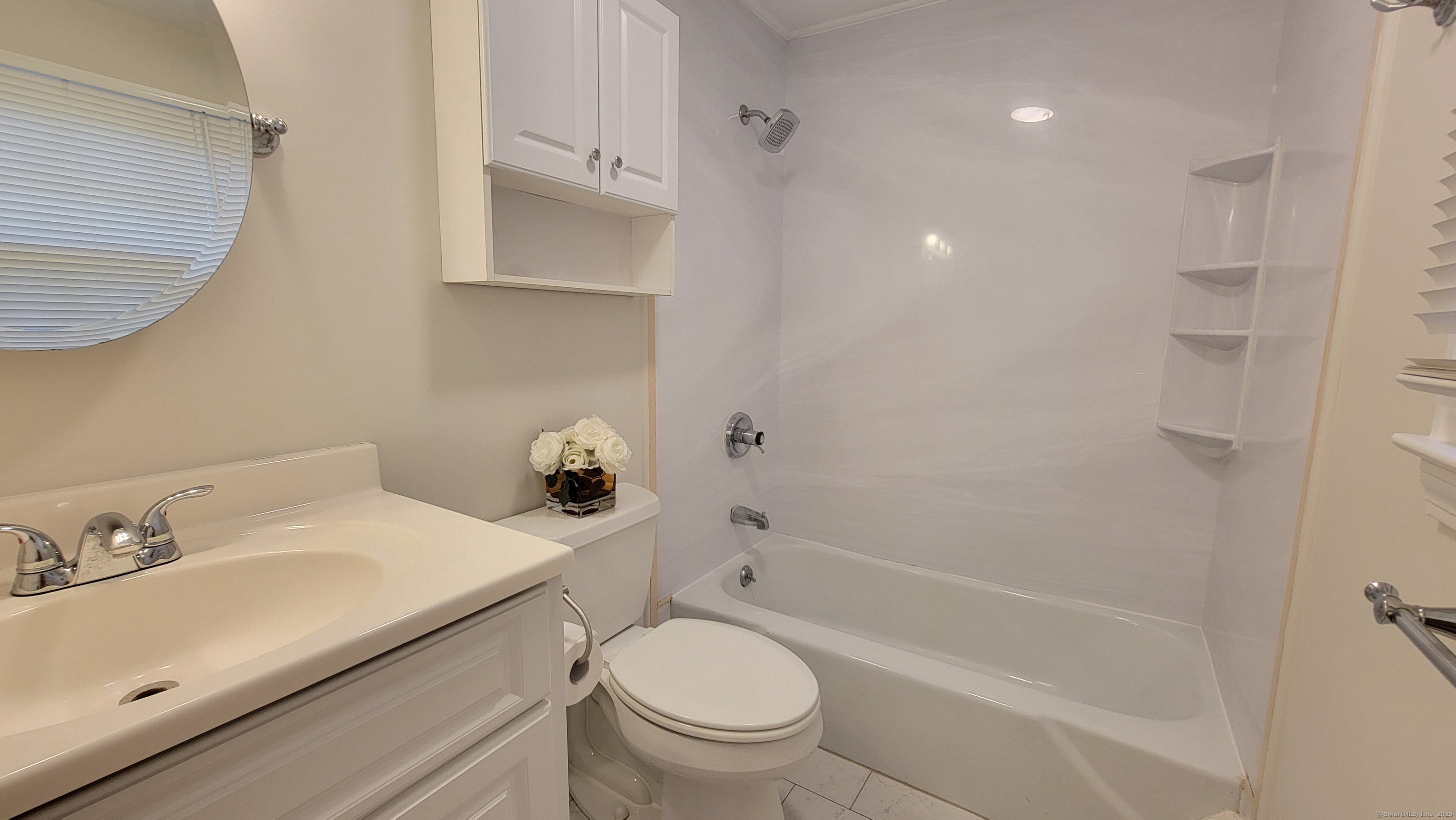 12 Brewster Road, Unit 12B Glastonbury, CT 06033 - Photo 15 of 19 a bathroom with a sink a toilet and shower
