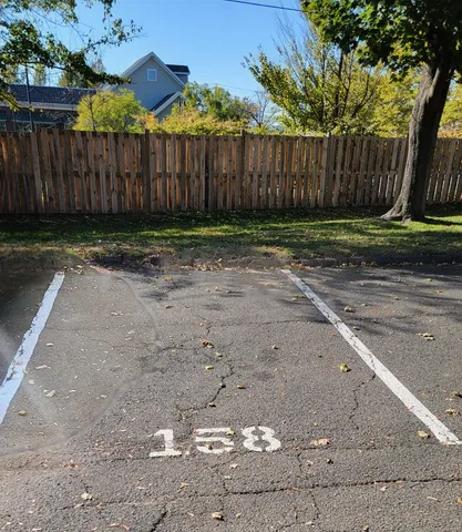 a view of a backyard with wooden fence