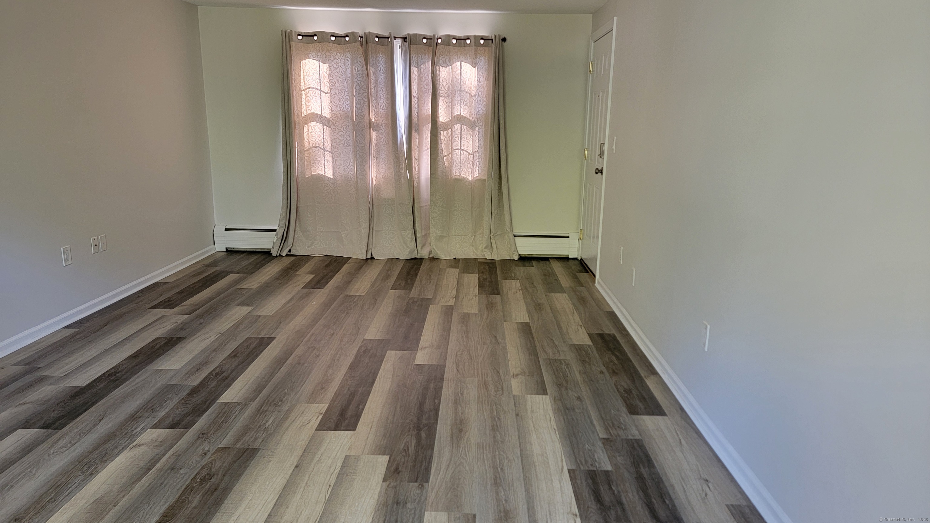 12 Brewster Road, Unit 12B Glastonbury, CT 06033 - Photo 5 of 19 a view of a room with wooden floor