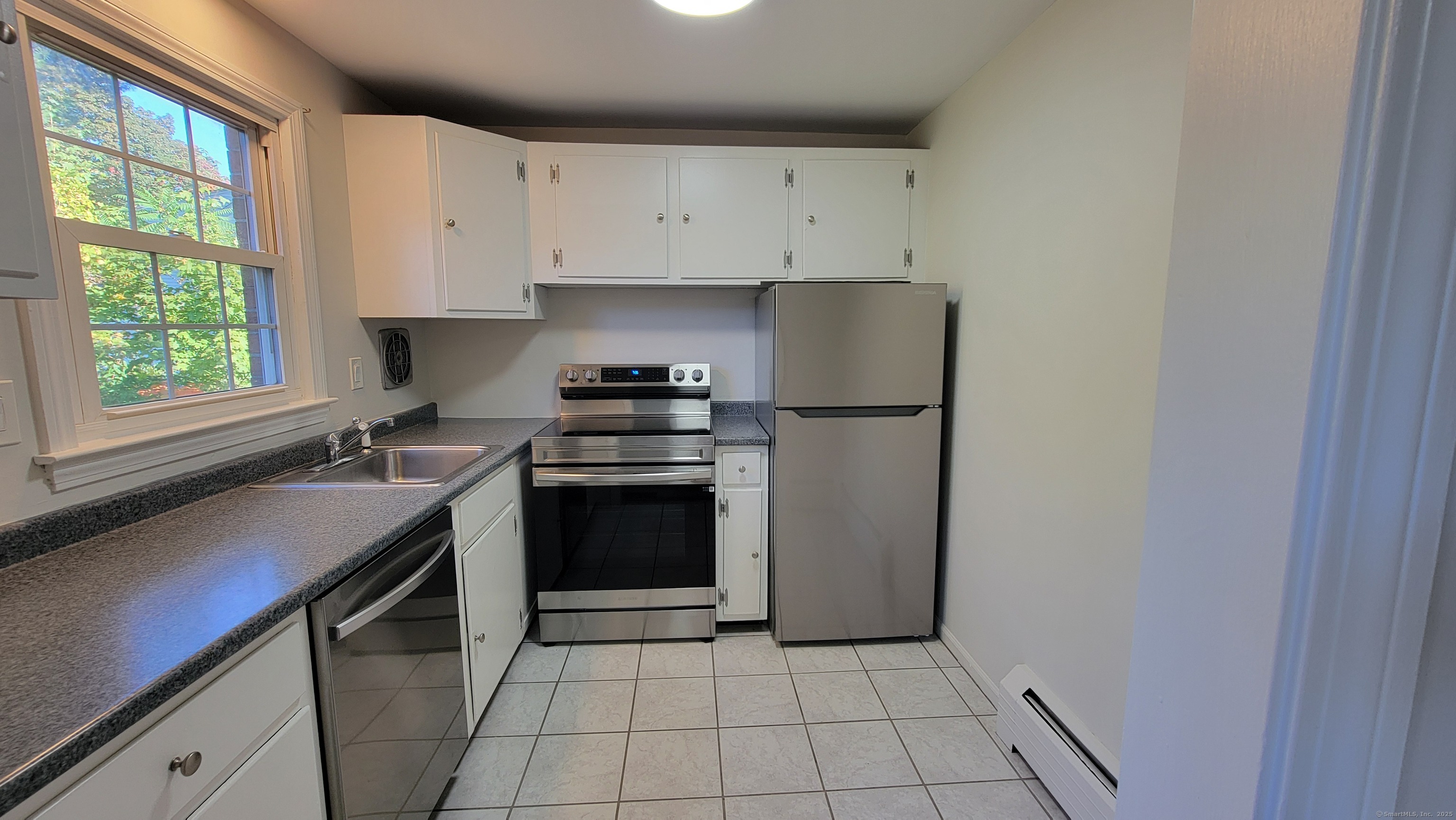 12 Brewster Road, Unit 12B Glastonbury, CT 06033 - Photo 6 of 19 a kitchen with a sink appliances and cabinets