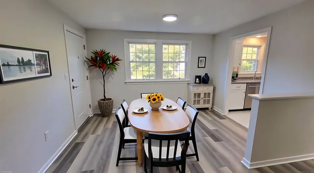 a view of a dining room with furniture and window