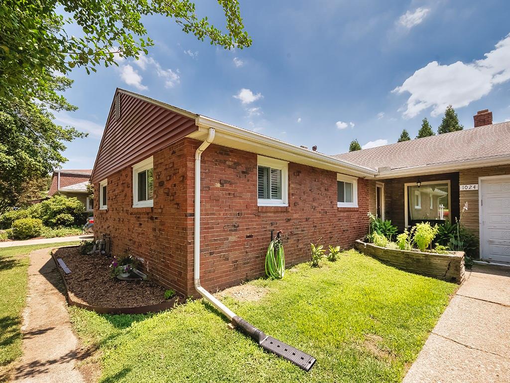 1024 Knollwood Road New Kensington, PA 15068 - Photo 2 of 23 a front view of a house with a yard