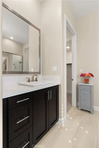 a spacious bathroom with a sink double vanity and a mirror