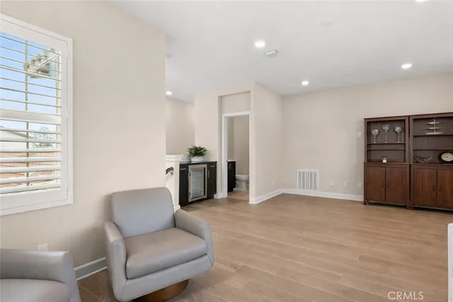a living room with furniture and natural light