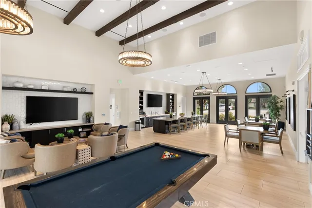 a living room with lots of furniture and flat screen tv