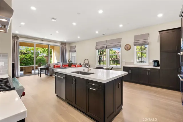 a kitchen with a sink and large window