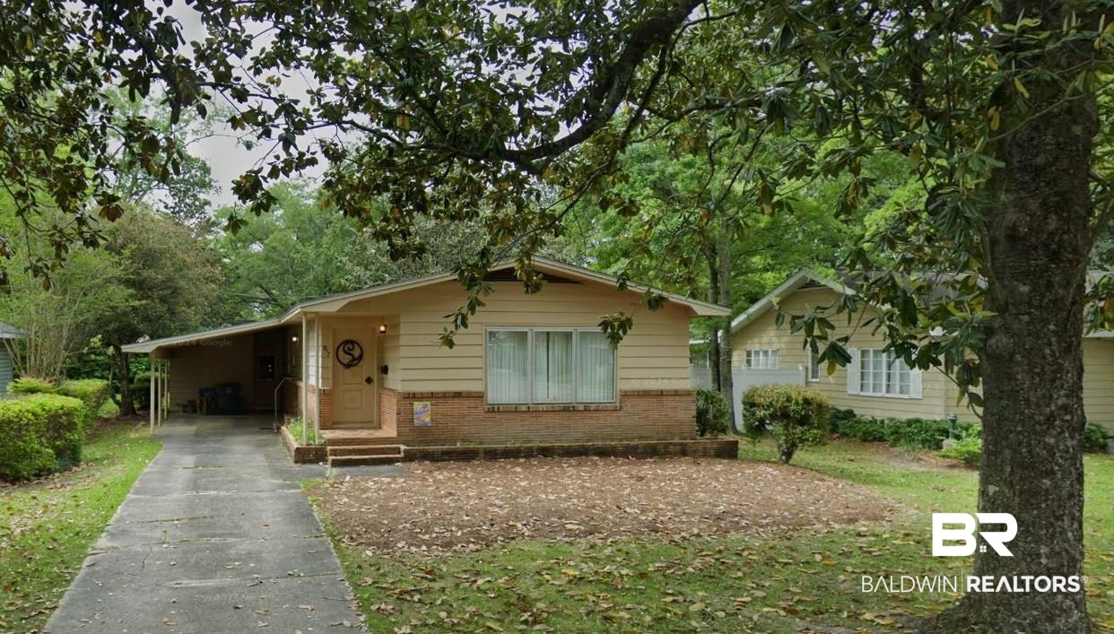 217 West Magnolia Avenue Foley, AL 36535 - Photo 1 of 21 View of front of house featuring a carport