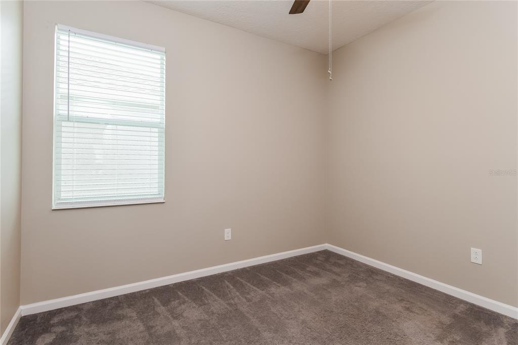 1073 Hendon Loop Davenport, FL 33837 - Photo 12 of 15 an empty room with a window