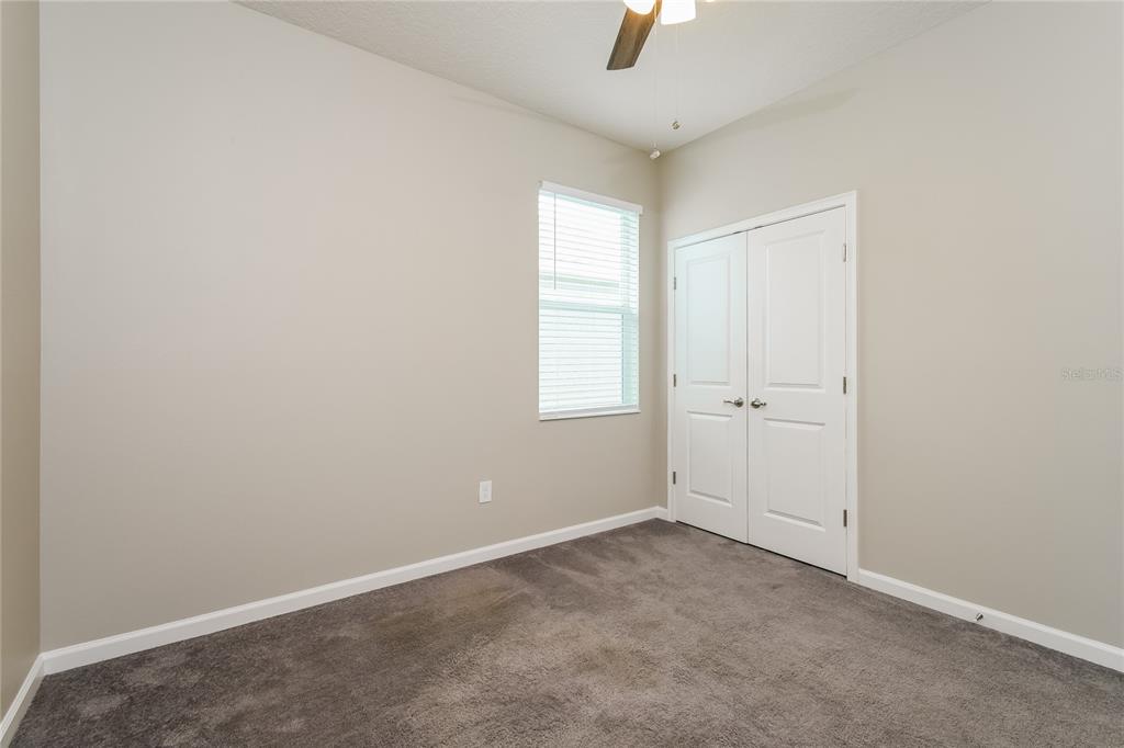 1073 Hendon Loop Davenport, FL 33837 - Photo 14 of 15 an empty room with a window