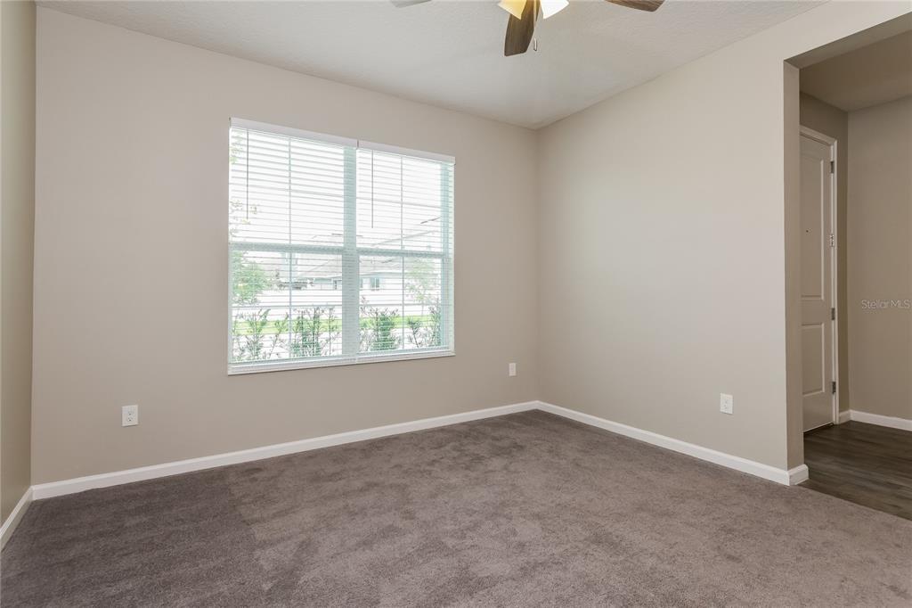 1073 Hendon Loop Davenport, FL 33837 - Photo 3 of 15 an empty room with a window