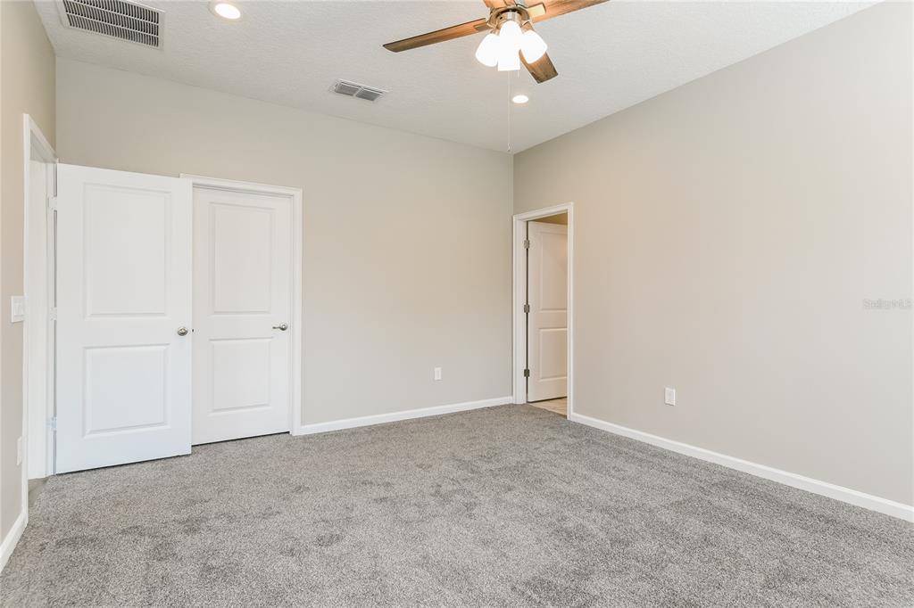 1073 Hendon Loop Davenport, FL 33837 - Photo 10 of 15 an empty room with a view of a room