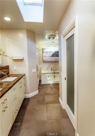 a bathroom with a sink and mirror