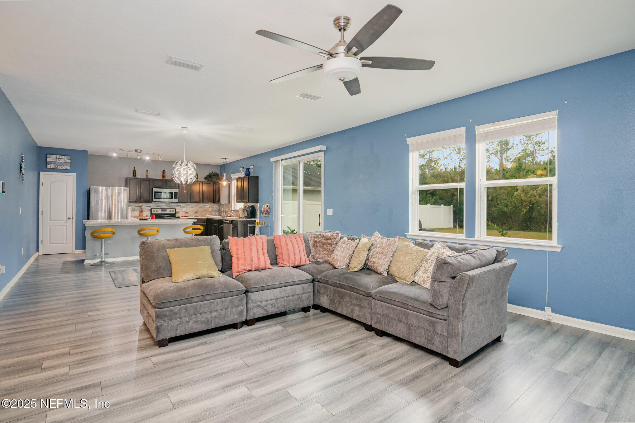 97500 Albatross Drive Yulee, FL 32097 - Photo 12 of 28 a living room with furniture and a large window