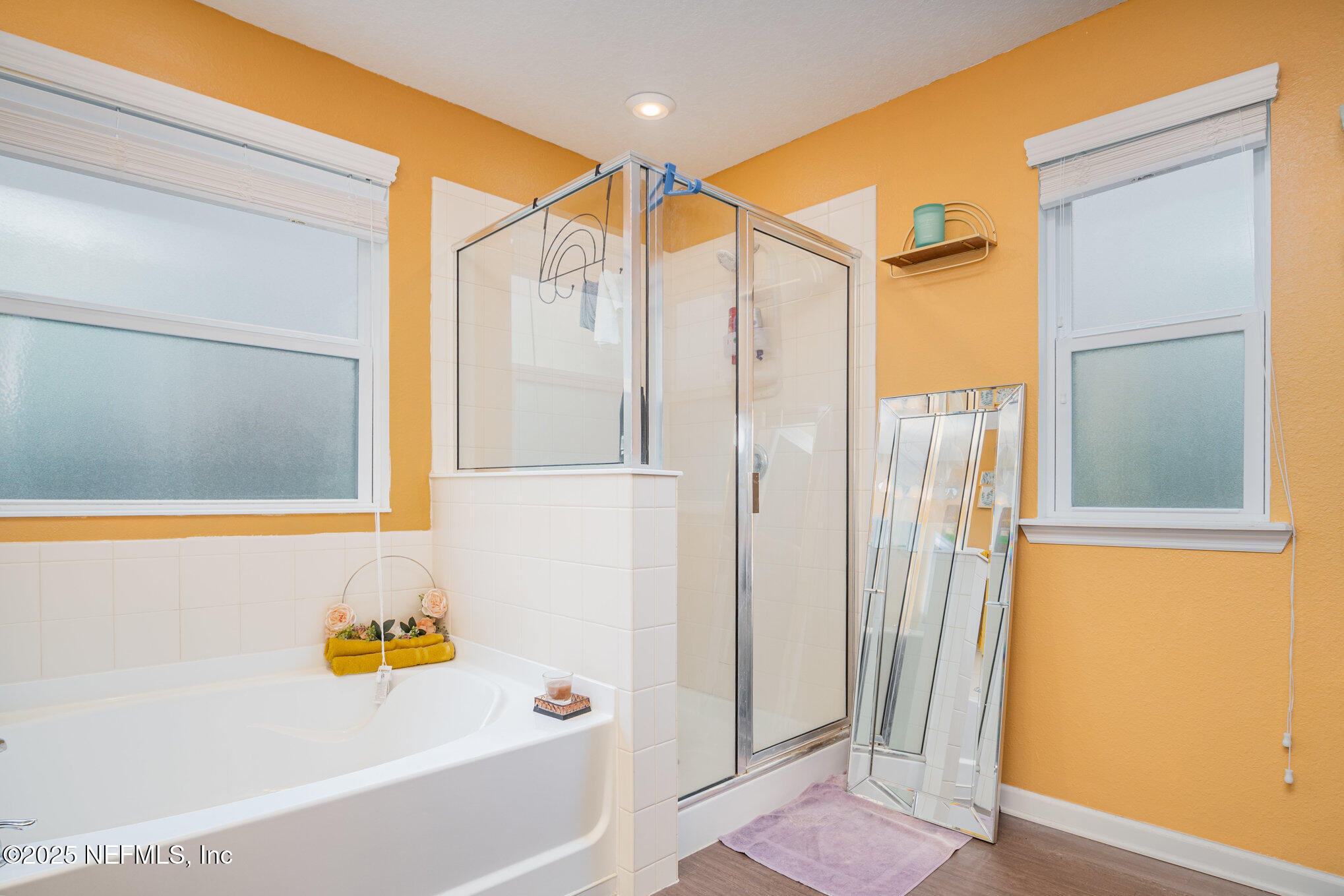 97500 Albatross Drive Yulee, FL 32097 - Photo 18 of 28 a bathroom with a bathtub and a shower