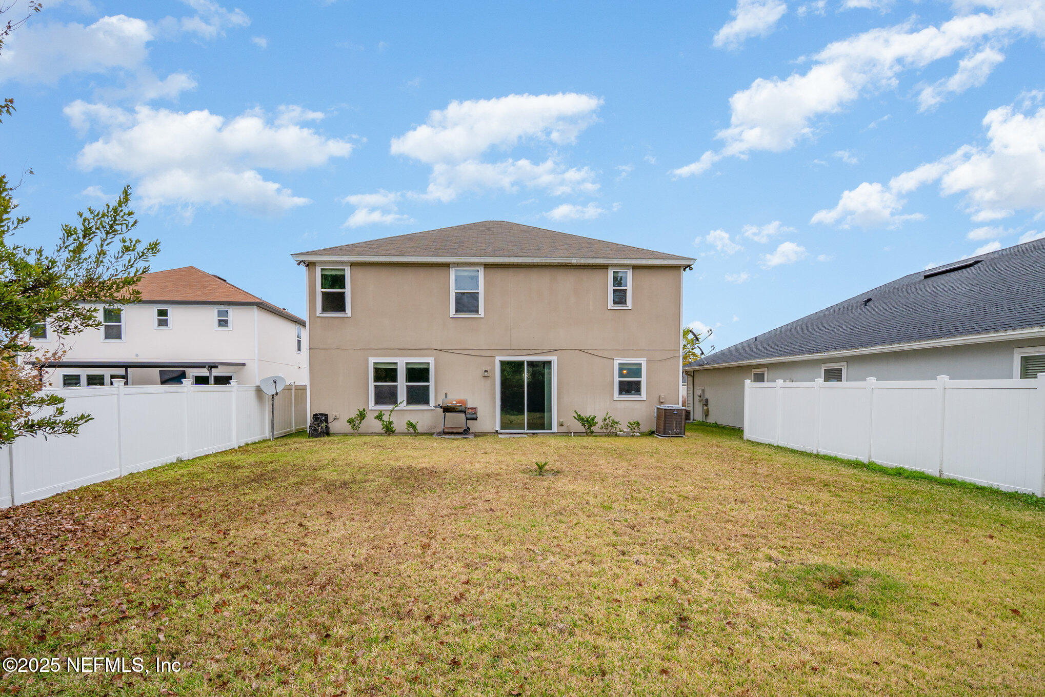 97500 Albatross Drive Yulee, FL 32097 - Photo 27 of 28 a view of a house with a patio