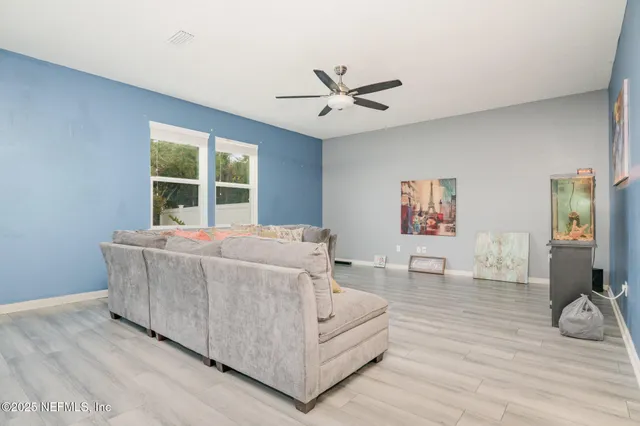 a living room with furniture and a window