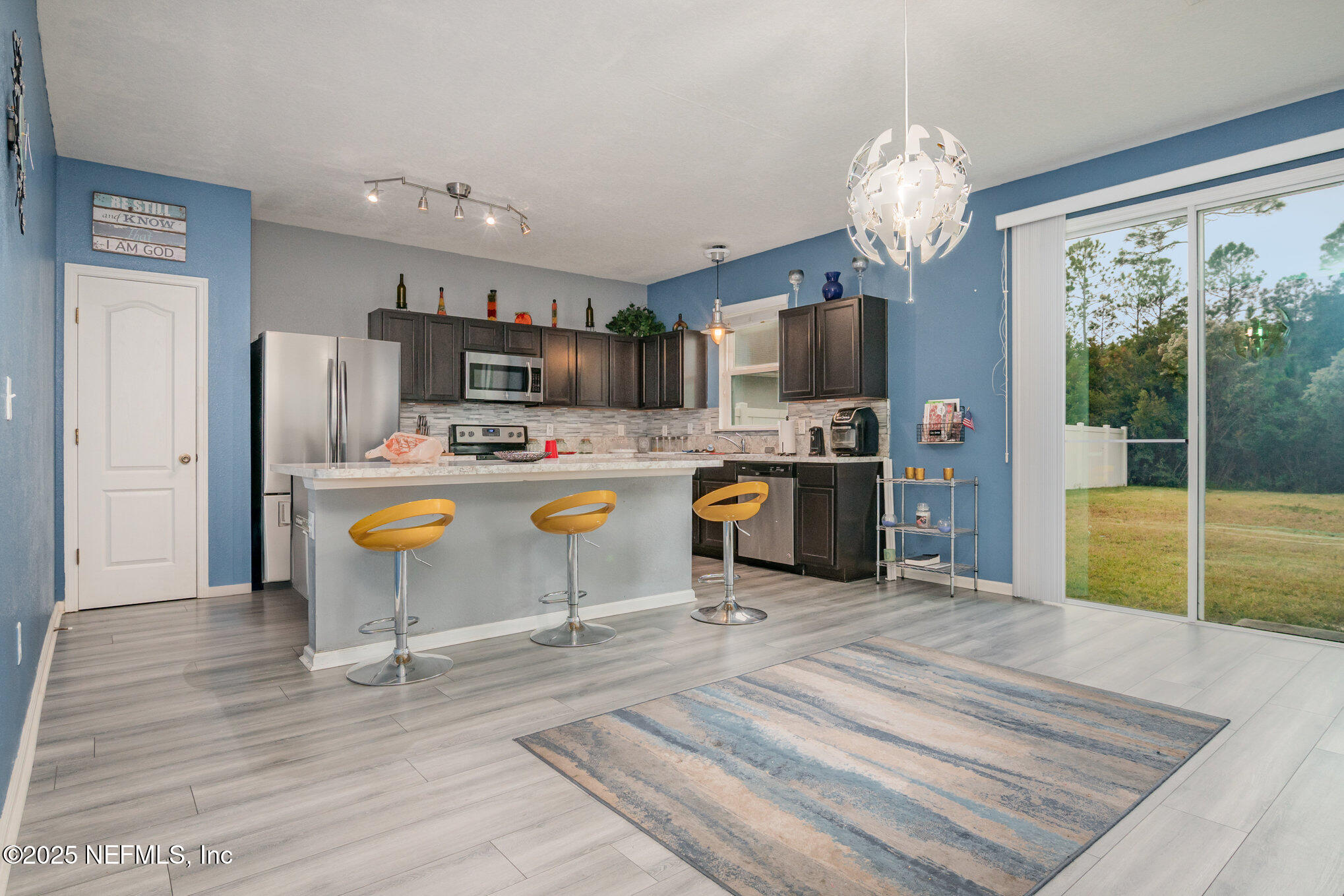 97500 Albatross Drive Yulee, FL 32097 - Photo 7 of 28 a view of kitchen dining table and chairs