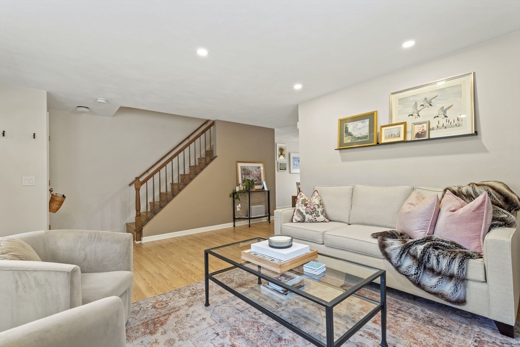 4 Apple Ridge Road, Unit 6 Maynard, MA 01754 - Photo 8 of 40 a living room with furniture and wooden floor
