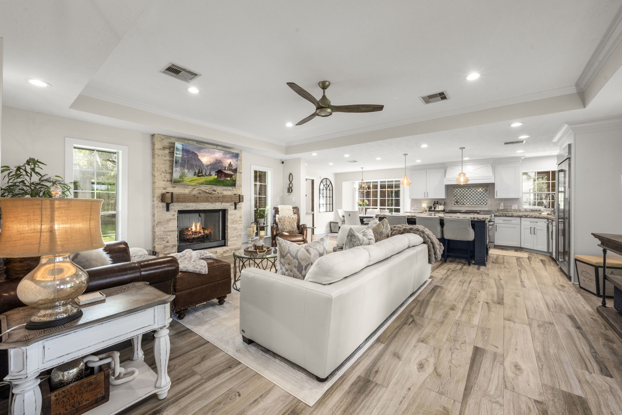 a living room with furniture fireplace and flat screen tv